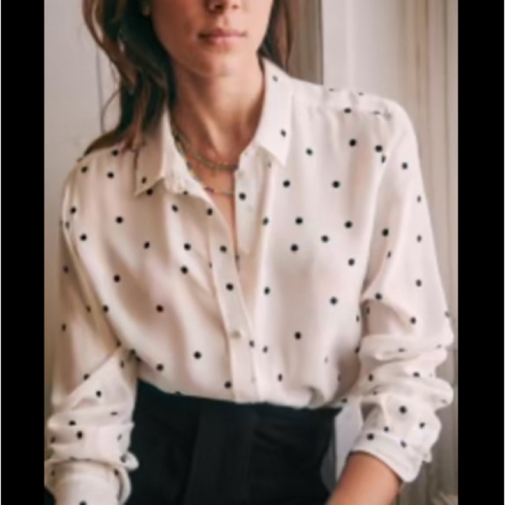 Silk button up shirt with fun polka dot details. A great staple with a twist!